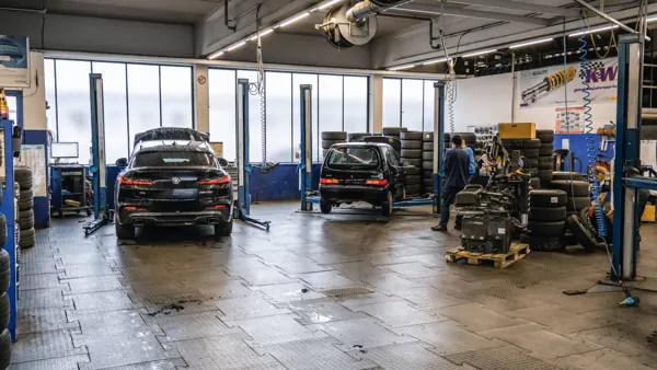 View into the workshop with lifts and cars